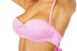 Improve breast shape and volume with a breast lift and augmentation